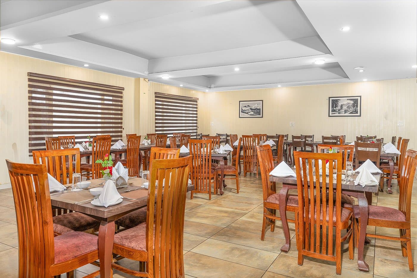 In-house dining hall at Hotel Sparrow with warm wooden furnishings
