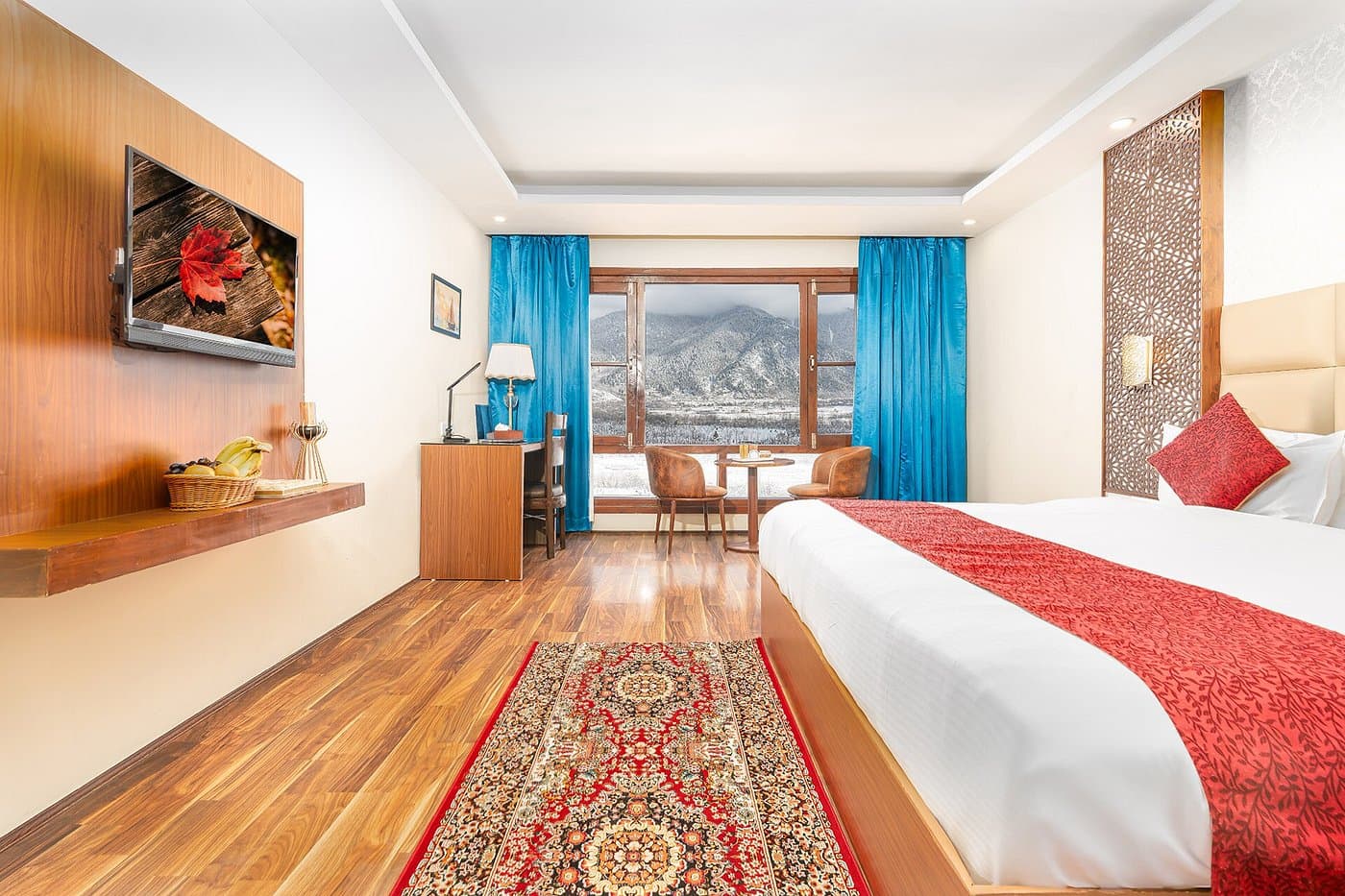 Superior room at Hotel Sparrow with a king bed facing panoramic Himalayan mountain views