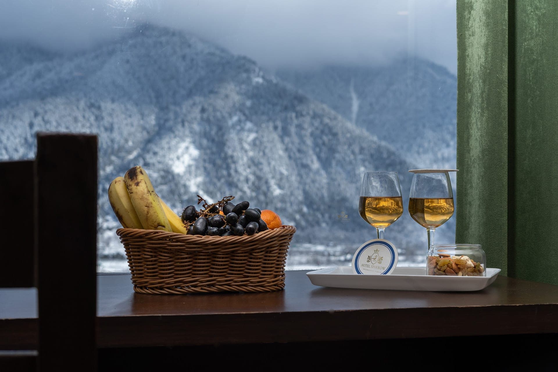 View of snow-covered Himalayan mountains from a Hotel Sparrow room window